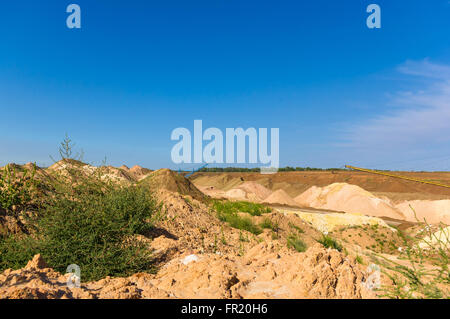 the quarry of clay in a cloudless summer day Stock Photo