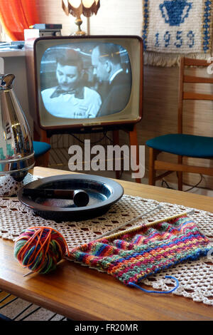 Mid 60es Swedish middle class sitting room with B&W TV set.  Interior design. Stock Photo