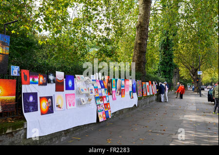 Paintings by British artists on display for sale along Bayswater Road, London, United Kingdom. Stock Photo