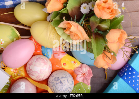 Easter background with eggs, ribbons and spring decoration Stock Photo