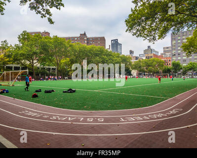 Football being played at Chelsea Ballfields, New York City, USA. Stock Photo