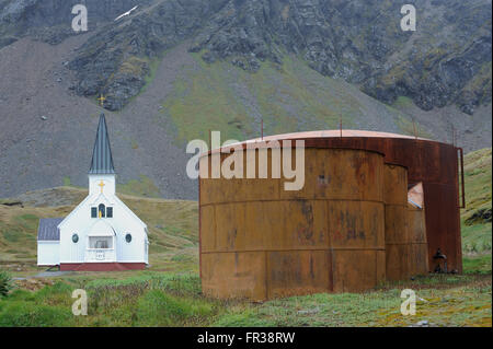 The Norwegian Lutheran Church stands among the rusting ruins of the whaling station. Grytviken, South Georgia Stock Photo