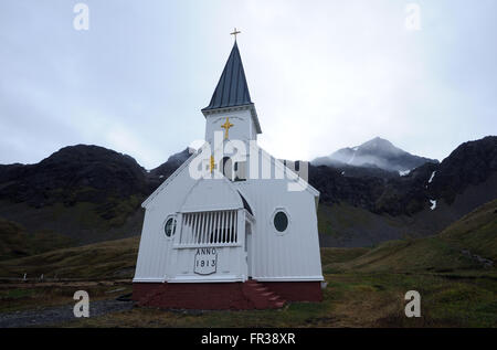 The Norwegian Lutheran Church stands among the rusting ruins of the whaling station. Grytviken, South Georgia Stock Photo