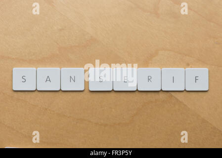 Keyboard letters spell san serif, a type of font without embellishment Stock Photo