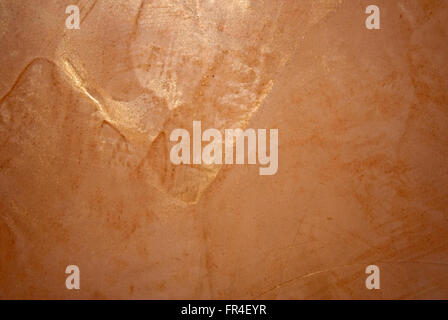 Bronze background texture painted on a wall Stock Photo