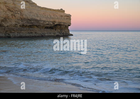 Beach scene during twilight in Albandeira. Lagoa, Algarve, Portugal Stock Photo