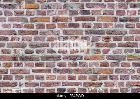 Old brick wall background, different size and color bricks Stock Photo
