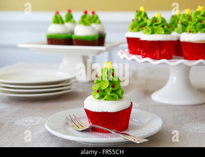 Cupcakes decorated with Christmas trees Stock Photo