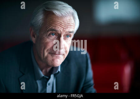 Pensive senior businessman looking away Stock Photo