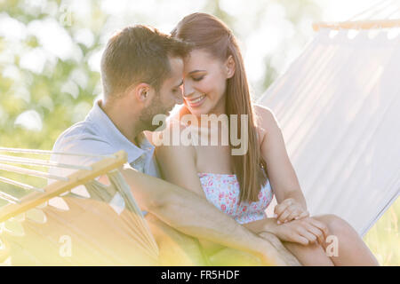 Affectionate young couple in summer hammock Stock Photo