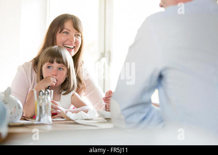 Family at cafe table Stock Photo