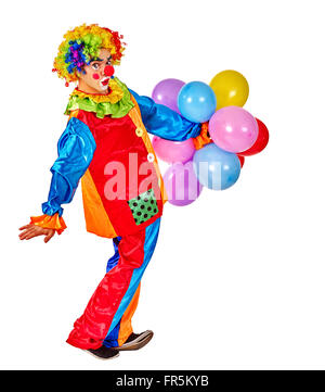 Happy birthday clown holding  bunch of balloons. Stock Photo