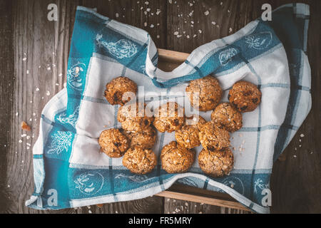 Oatmeal cookies on a towel on the wooden table horizontal Stock Photo