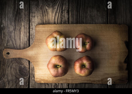 Red apples on a cutting board horizontal Stock Photo