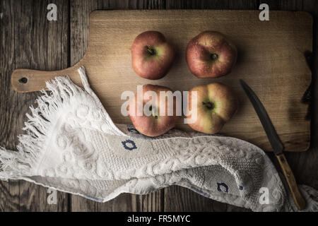 Red apples and towel on the cutting board horizontal Stock Photo