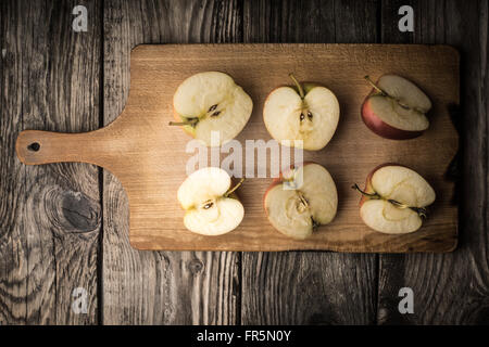 Apple halves on a cutting board horizontal Stock Photo