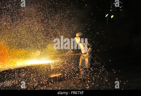 Industrial welder inside of steel plant Stock Photo