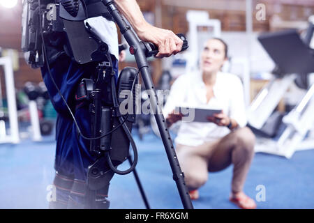 Equipment attached to man receiving physical therapy Stock Photo