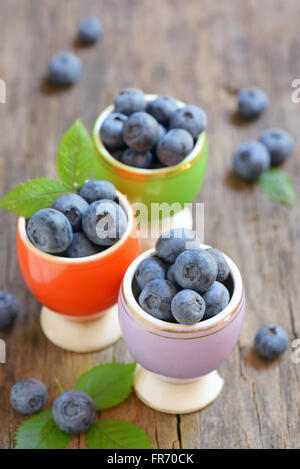 Freshly picked blueberries on wooden table Stock Photo