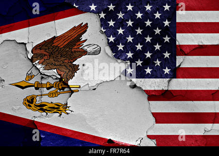 flags of American Samoa and USA painted on cracked wall Stock Photo