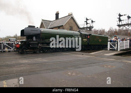 Flying Scotsman steam locomotive reversing to couple up to first train of the day at the North York Moors Railway Stock Photo