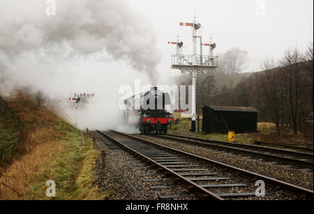 Flying Scotman steam locomotive leaving Goathland station shrouded in steam on the North Yorkshire Moors Heritage Railway (NYMR) Stock Photo