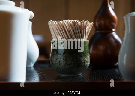 A small pot of tooth picks on a restaurant atble, Japanese food is served here. Stock Photo