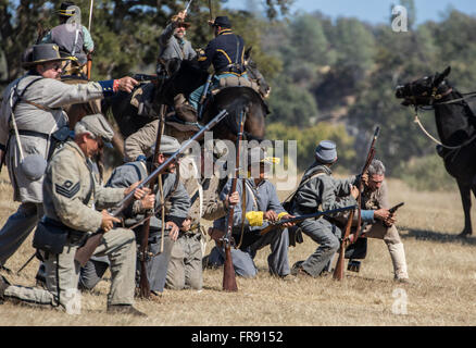 Confederate  Soldiers in Action at an American Civil War Reenactment at Hawes Farm, Anderson, California. Stock Photo