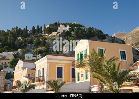 Gialos, Symi, South Aegean, Greece. Colourful buildings on the waterfront. Stock Photo