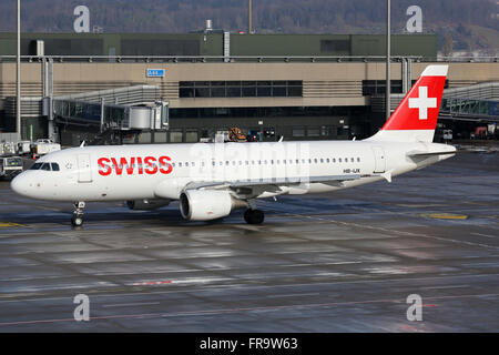 Zurich, Switzerland - January 23, 2016: A Swiss International Air Lines Airbus A320 with the registration HB-IJX taxis at Zurich Stock Photo