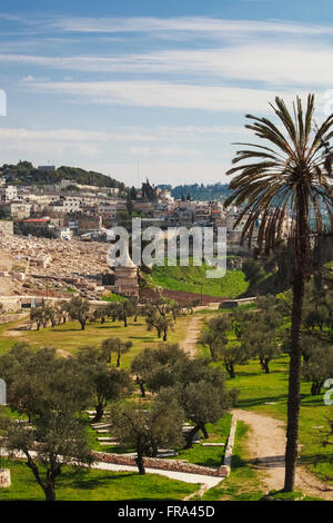 Absalom's tomb and graves in a cemetery; Jerusalem, Israel Stock Photo