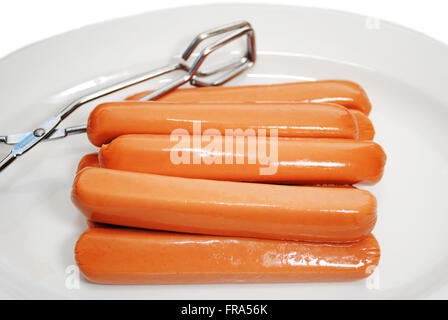 Raw Hot Dogs on a Plate Ready to be Cooked Stock Photo