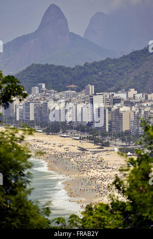 View of Copacabana Beach and Morro Two Brothers in the background from the top of Morro do Leme Stock Photo