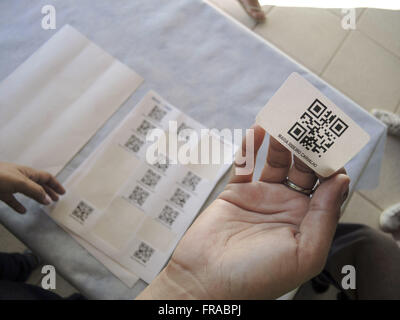 QR code or QR Code stickers with names of people Stock Photo