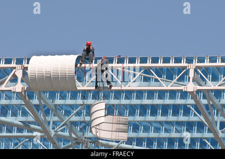 Workmen working on the roof - construction of the multipurpose complex Gremio Arena Stock Photo