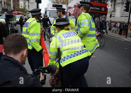November 5th 2015. London, UK. Police, persued by the media, eject one protester by picking him up and laying him down in the centre of Whitehall, London. ©Marc Ward/Alamy Stock Photo