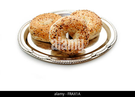 Delicious Multigrain Bagels Served on a Silver Platter Stock Photo