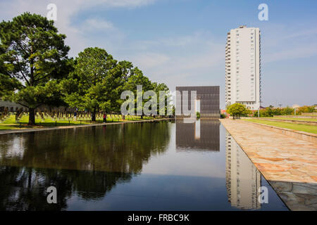 One of the Gates of Time and the reflection pool at the Oklahoma City memorial, in Oklahoma City, Oklahoma, USA. Stock Photo