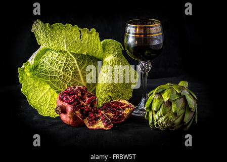 Fruit, vegetables and wine on dark background Stock Photo