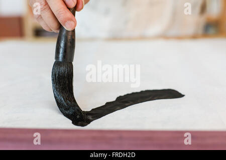 Writing Chinese calligraphy scene, the Chinese character 'one' Stock Photo