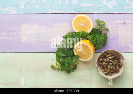 Chimichurri parsley sauce. Ingredients for making chimichurri sauce on rustic table Stock Photo