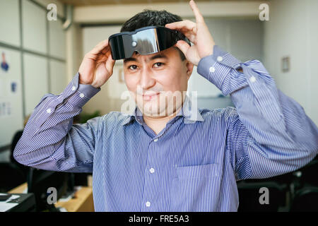 Man wears glasses virtual reality Stock Photo