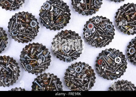 Bolts screws and nuts in containers top view concept Industry Stock Photo