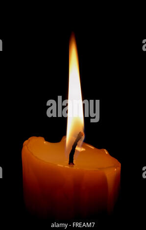 Candle on black background Stock Photo