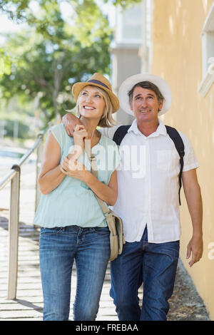 Couple walking on sidewalk Stock Photo