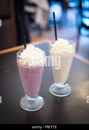 A mixed berry milkshake and chai tea milkshake from Urban Diner in Edmonton, Alberta, Canada. Stock Photo