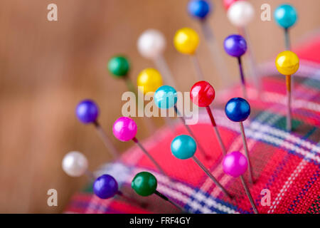 macro colored sewing pins in scottish pincushion Stock Photo