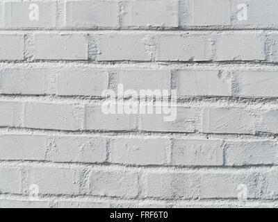 wall made of bricks painted in white creates a pattern Stock Photo