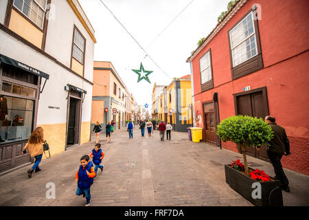 LA LAGUNA, TENERIFE island, SPAIN - DECEMBER 26, 2015: Street view with colorful buildings and people walking in La Laguna city Stock Photo