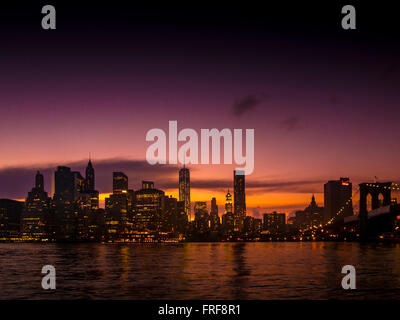 Manhattan skyline at sunset with Brooklyn Bridge, New York, USA. Stock Photo